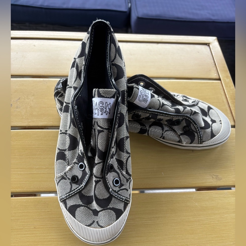 Coach slip on sneaker, black and white 
Size 8 1/2 B
